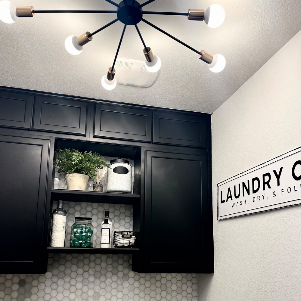 Laundry room with cabinets, light fixture,  and Laundry sign.