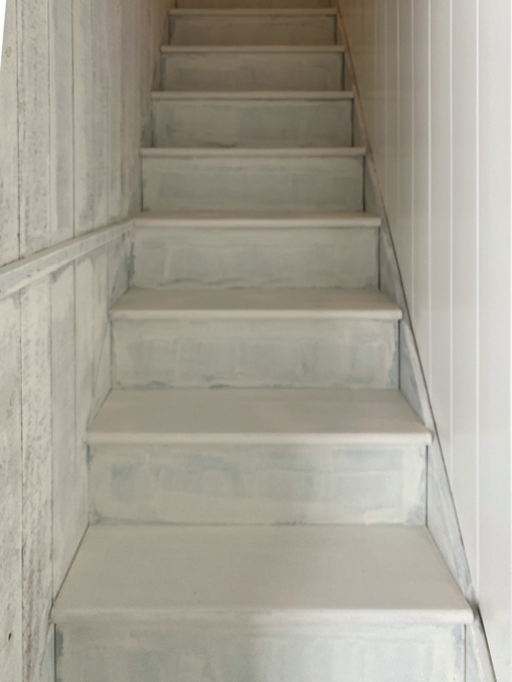 Staircase painted with white primer.