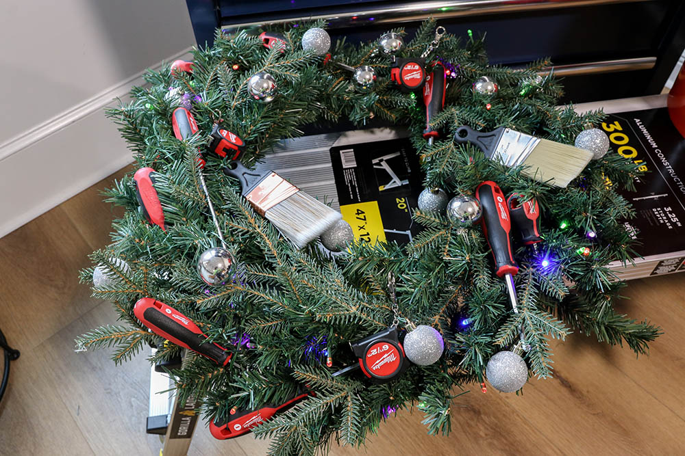 A wreath decorated with various tools.