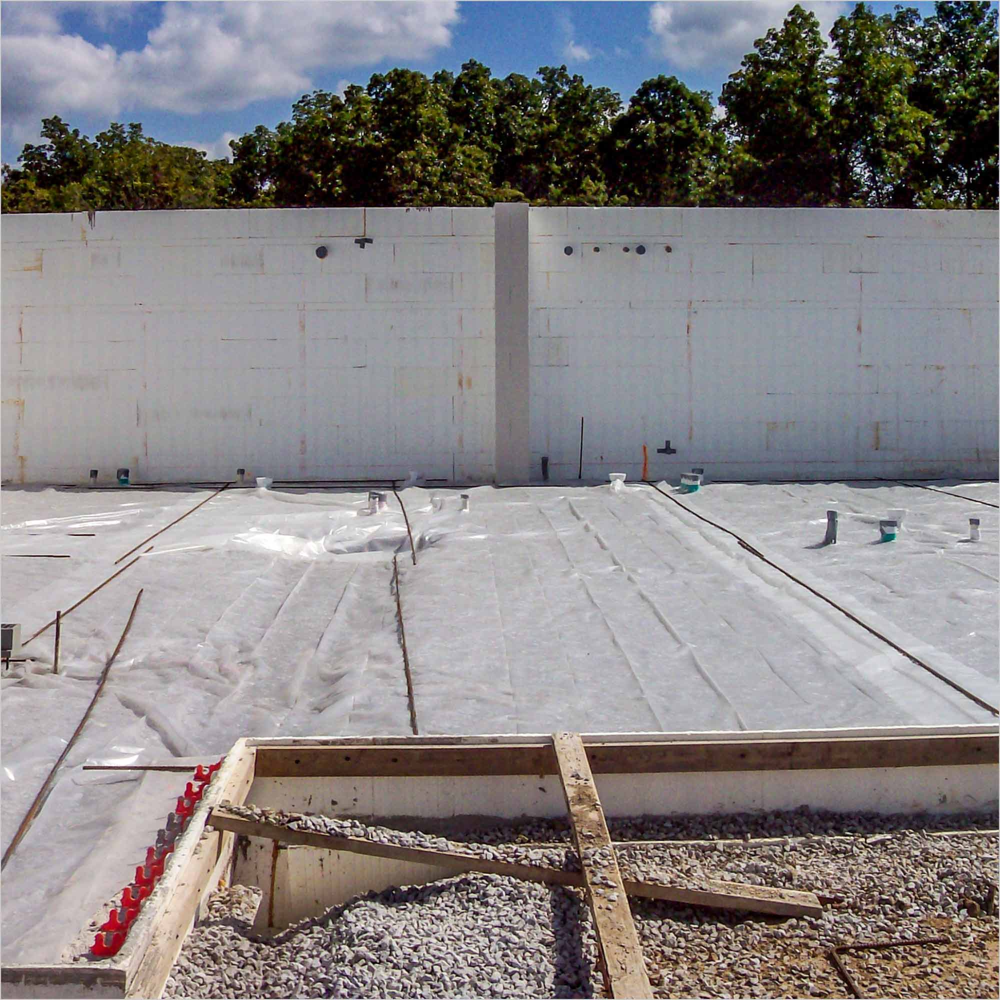 A construction site with concrete forms in place.