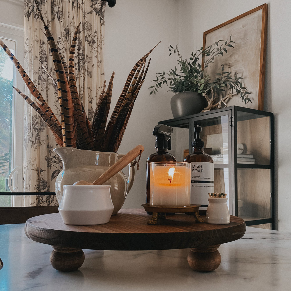 Overview of footed tray with decorative items on top. Overview of footed tray with decorative items on top.