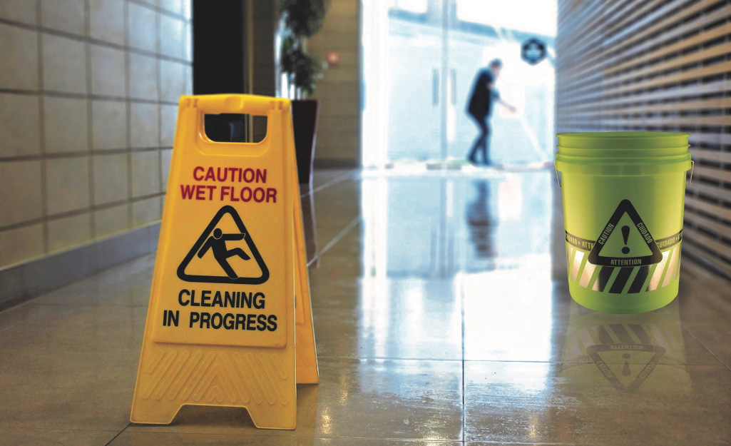A "Wet Floor" sign stands in a hallway.