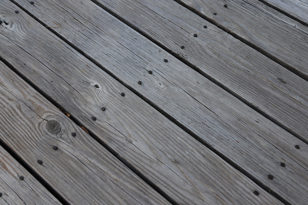A close up view of unstained deck boards. A close up view of unstained deck boards.