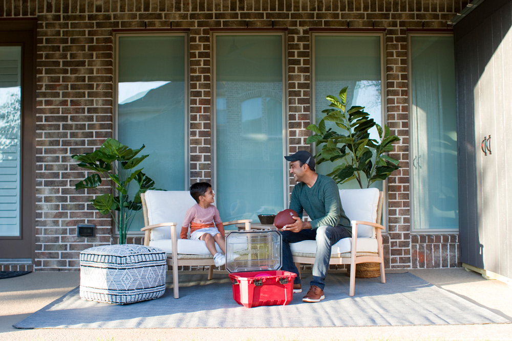 Two people sitting in the backyard. Two people sitting in the backyard.