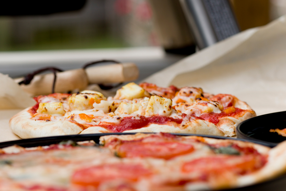 Close up photo of two fresh pizzas. 