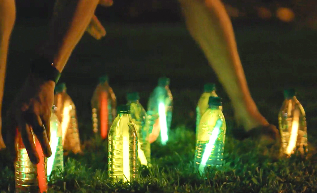 Water bottles filled with glow sticks.