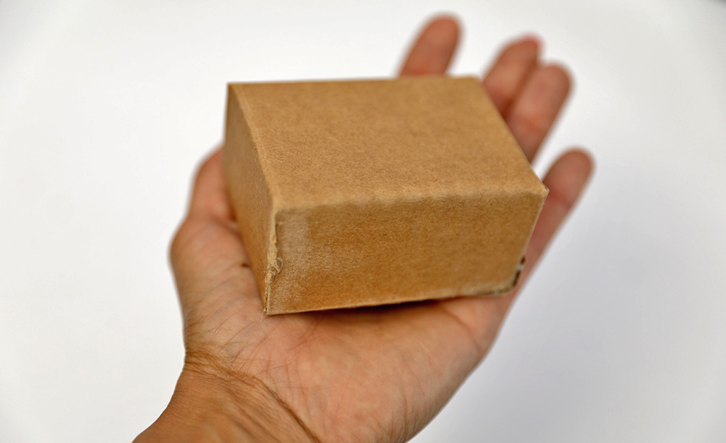 Cardboard folded into a rectangular box.