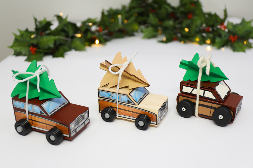 Three toy Christmas cars
