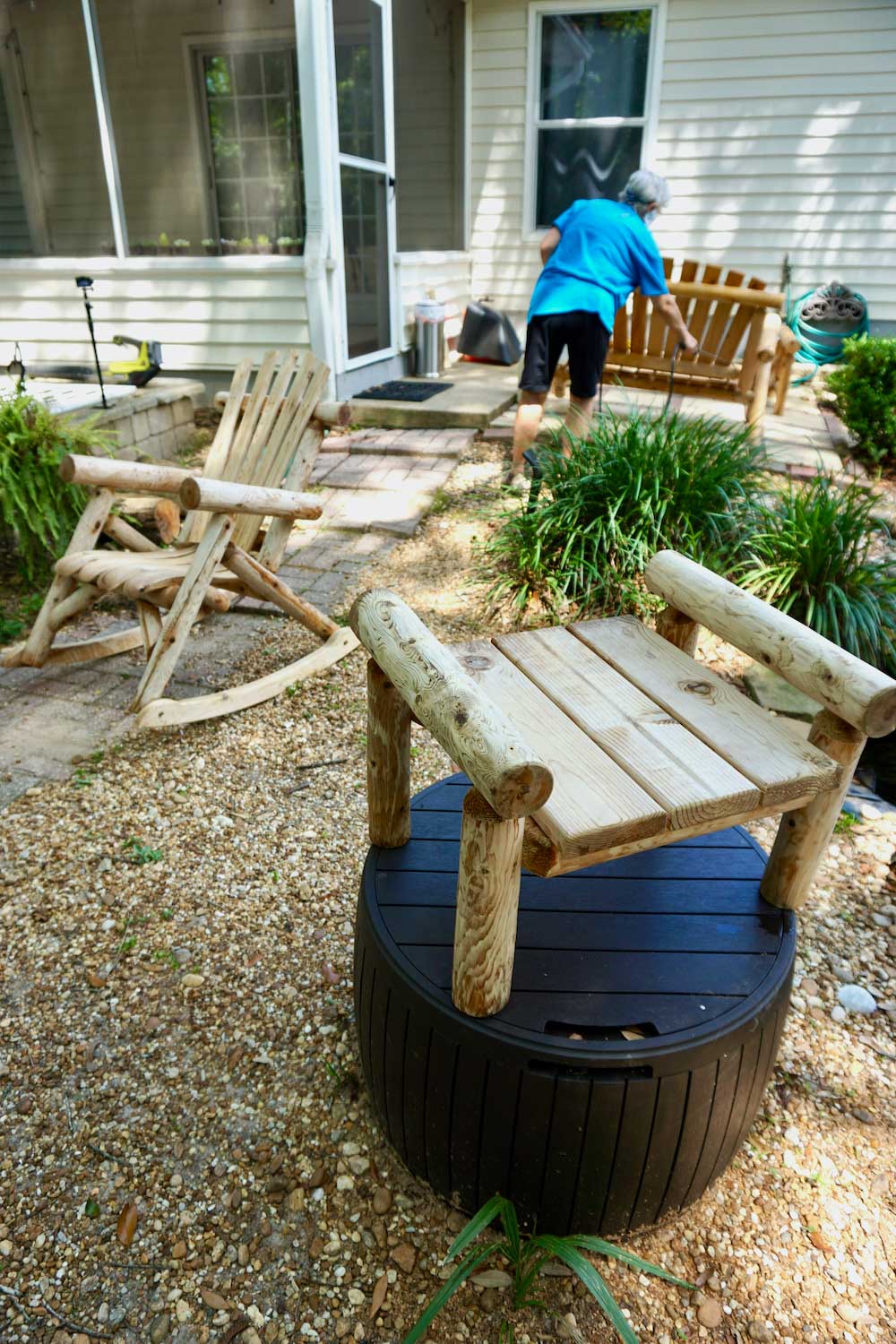 Various pieces of wooden furniture laid outside. Various pieces of wooden furniture laid outside.