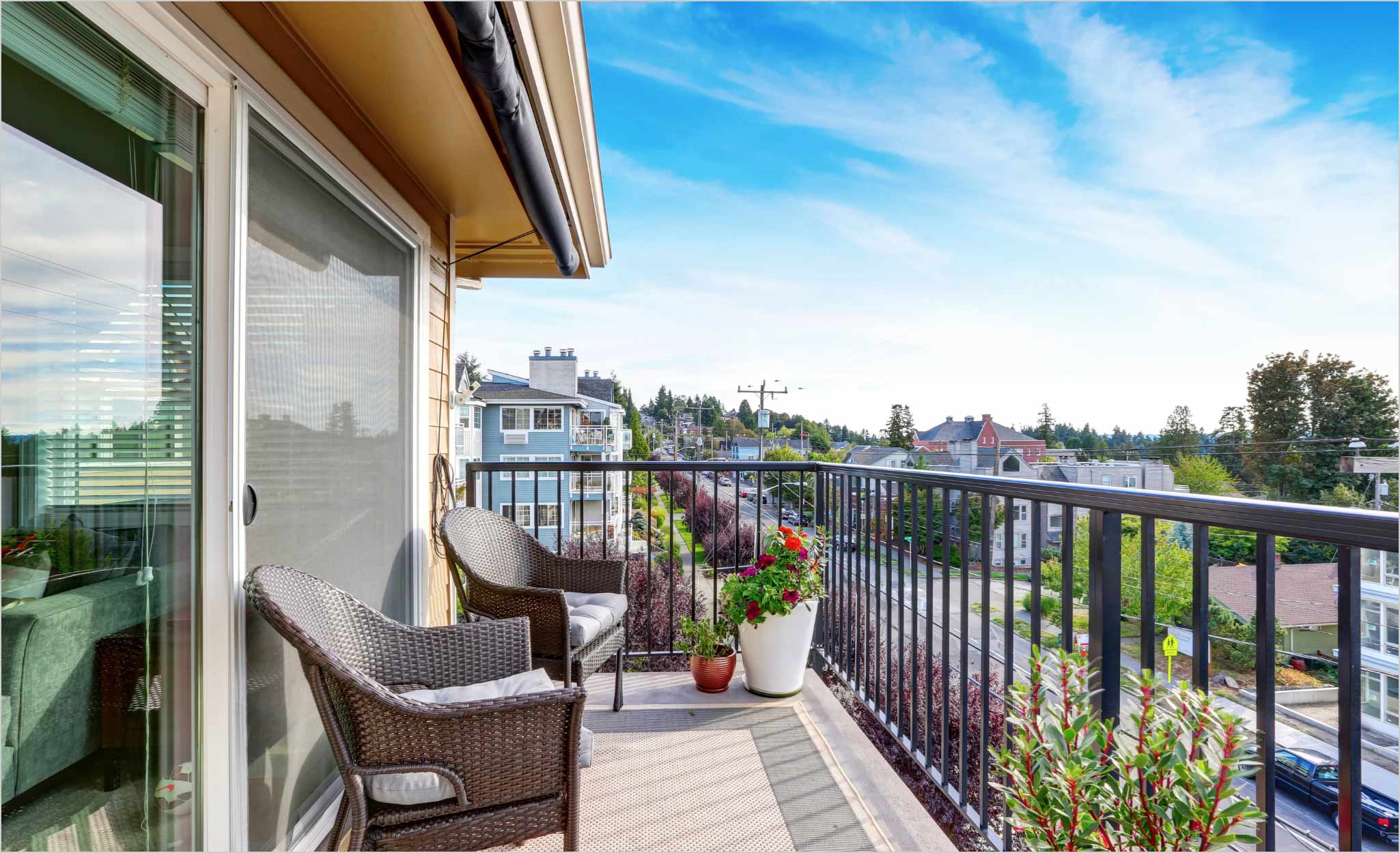 An apartment balcony offers a view.