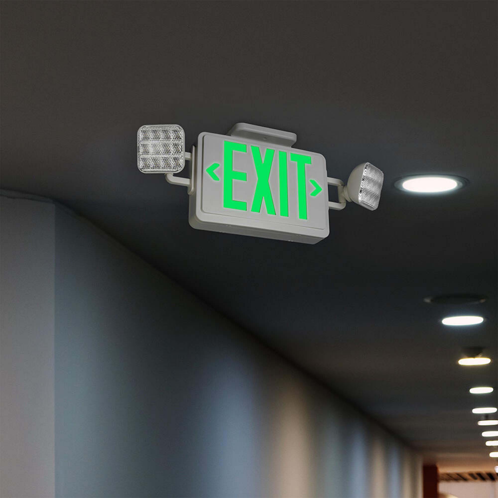An emergency sign and lights in a hallway.