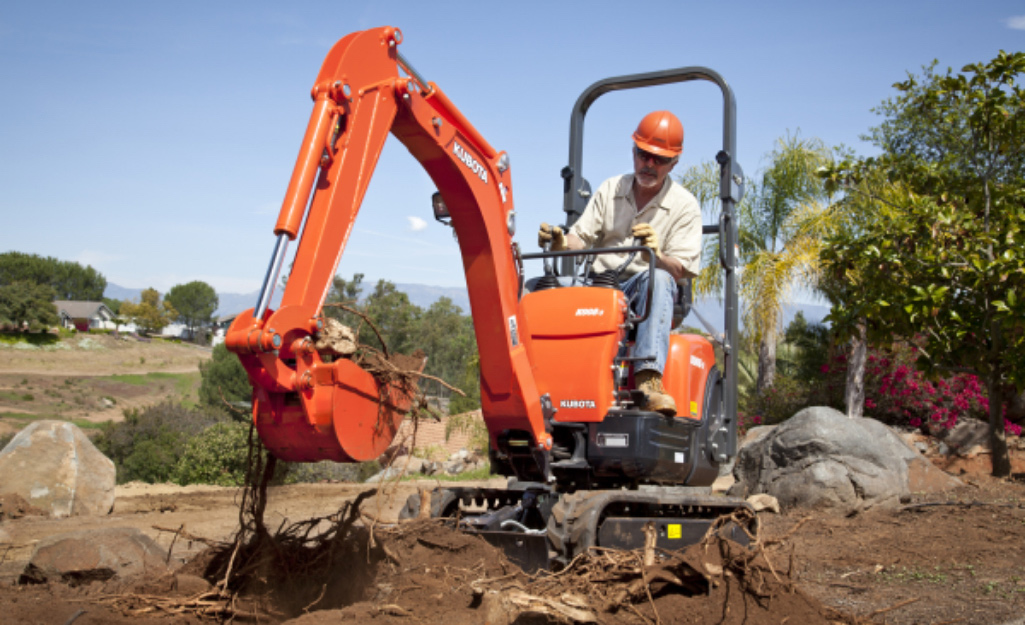 Professional Contractor Drives Mini Excavator