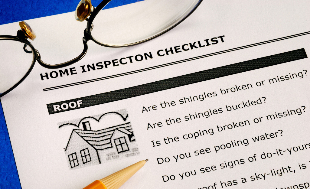 A home inspection checklist and glasses
