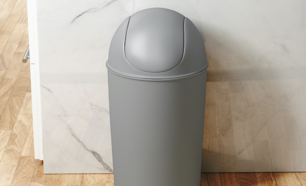 A gray trash bin