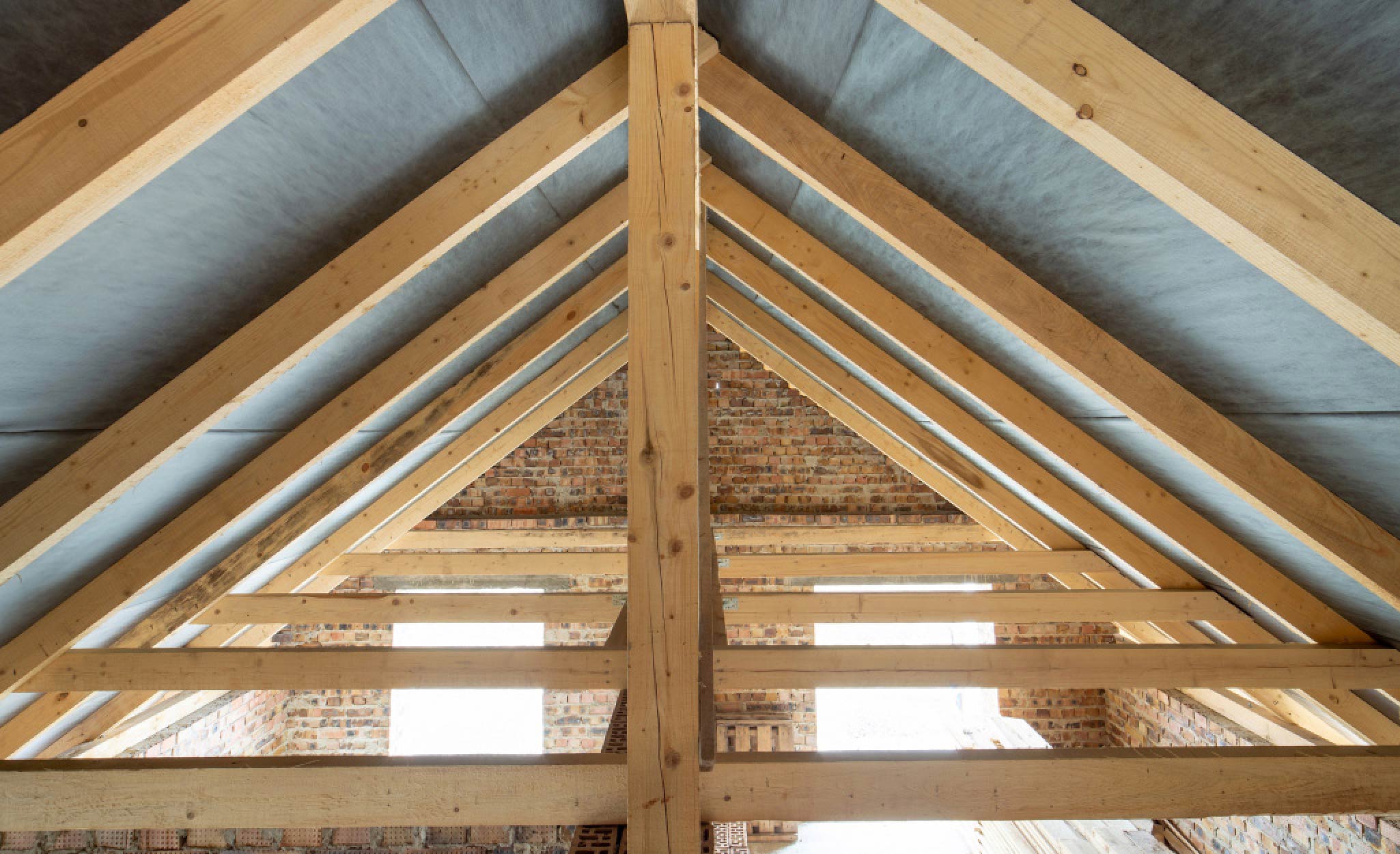 Roof rafters support an attic.