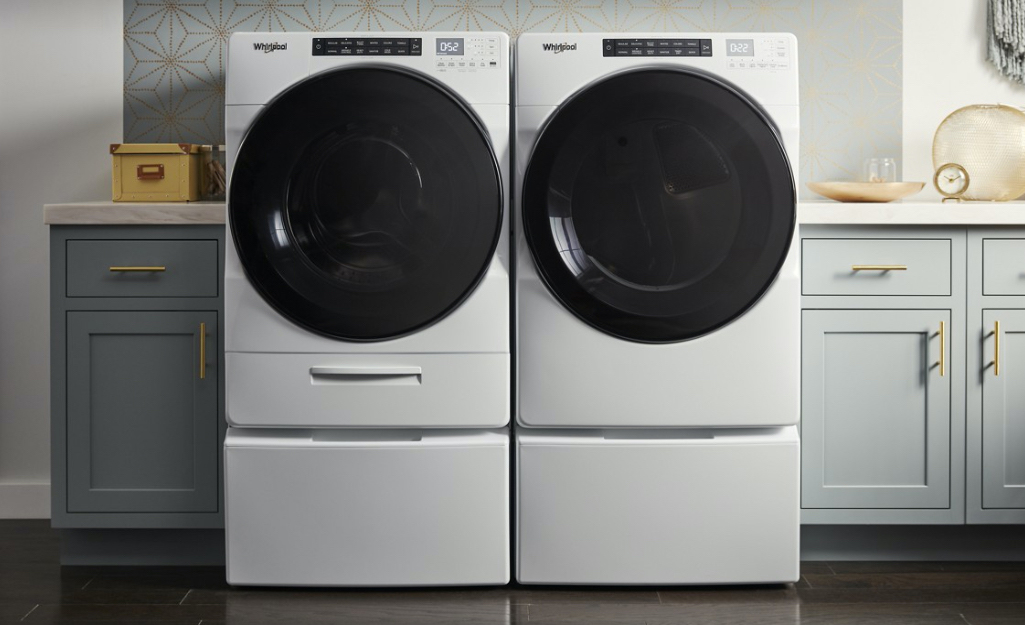 A Whirlpool washer/dryer in a laundry room.