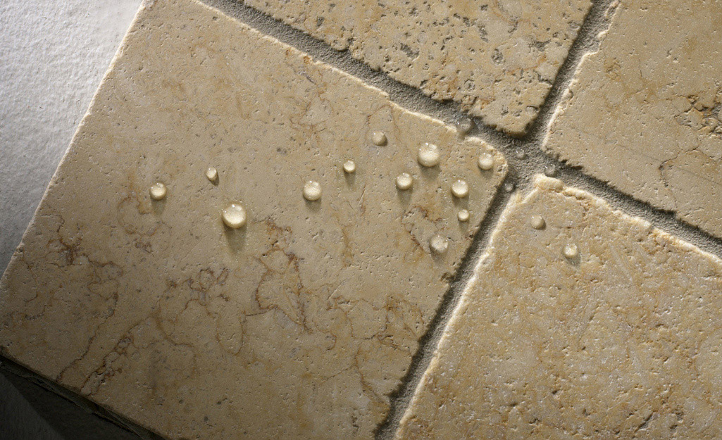 Water droplets on a tile floor.
