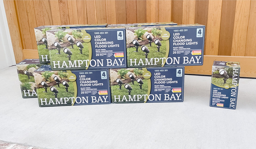 A set of boxed Hampton Bay outdoor lights.