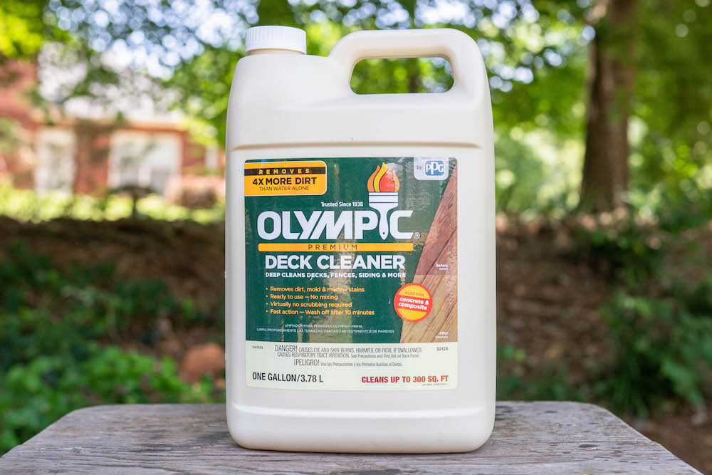 A bottle of Olympic Premium Deck Cleaner.