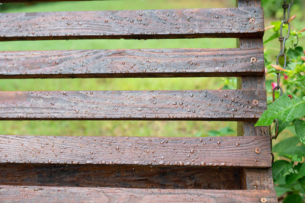 Water droplets on a weatherproofed exterior swing.