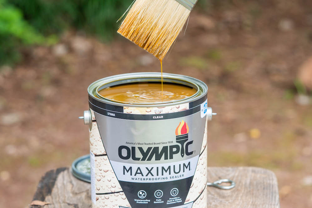 An open can of Olympic Maximum Waterproofing Sealer.