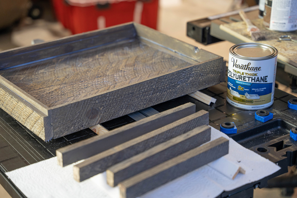 Wood set out to dry after staining next to a can of polyurethane. Wood set out to dry after staining next to a can of polyurethane.