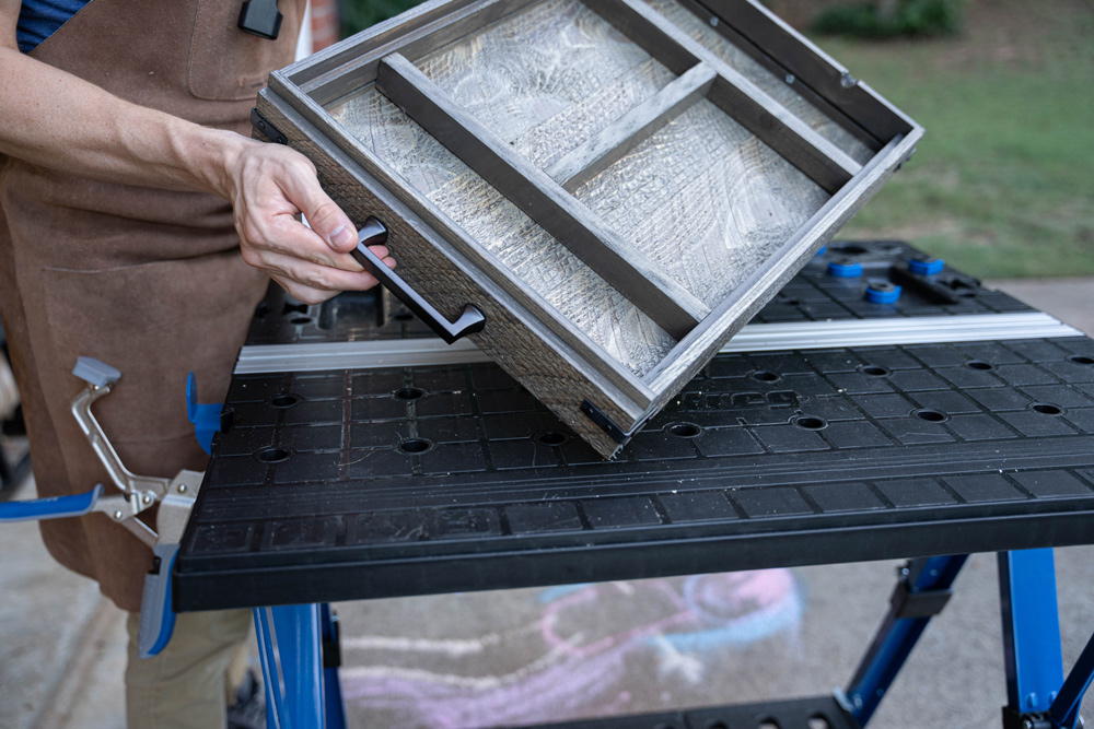 Person showing the finished product of the s’mores tray. Person showing the finished product of the s’mores tray.