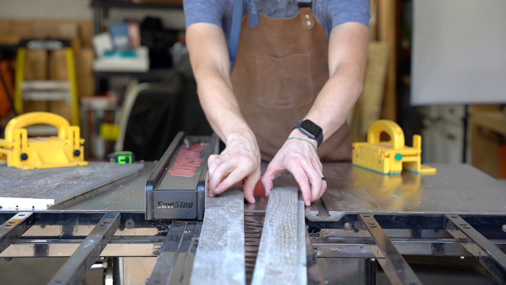 Man holding two pieces of wood. Man holding two pieces of wood.