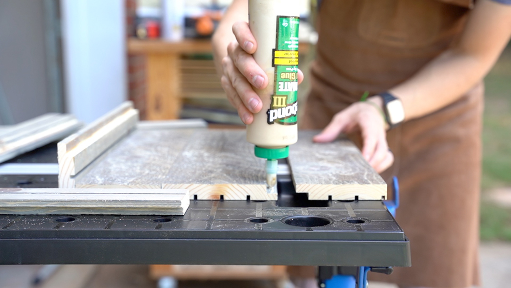 Man gluing wood together. Man gluing wood together.