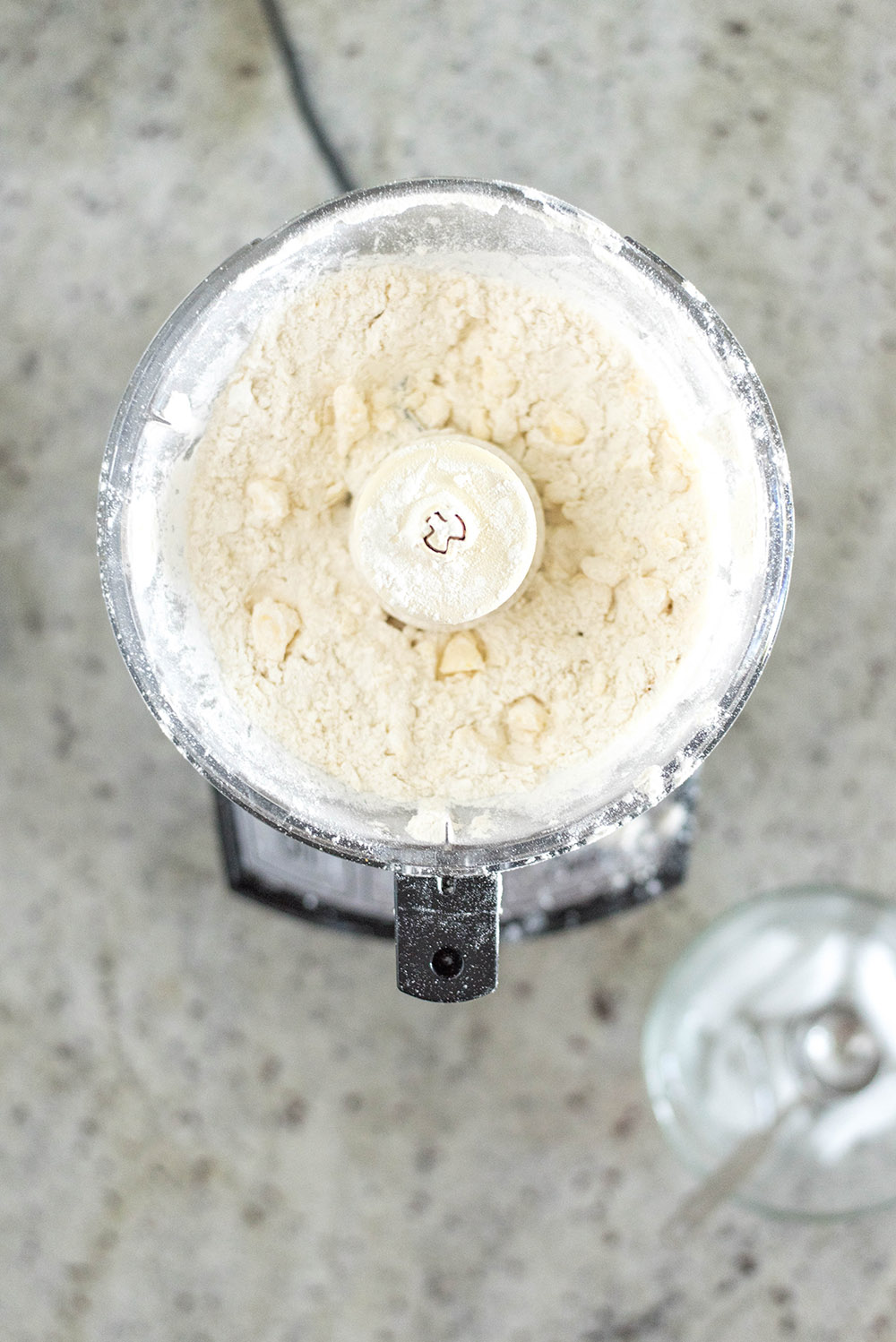 A food processor filled with ingredients.