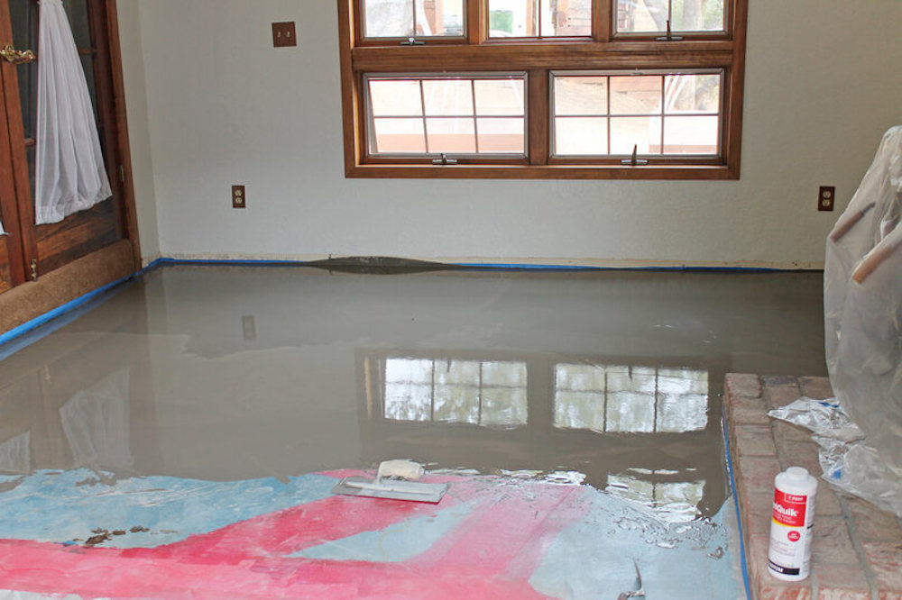 Glossed grey floor with open window centered in the shot 
