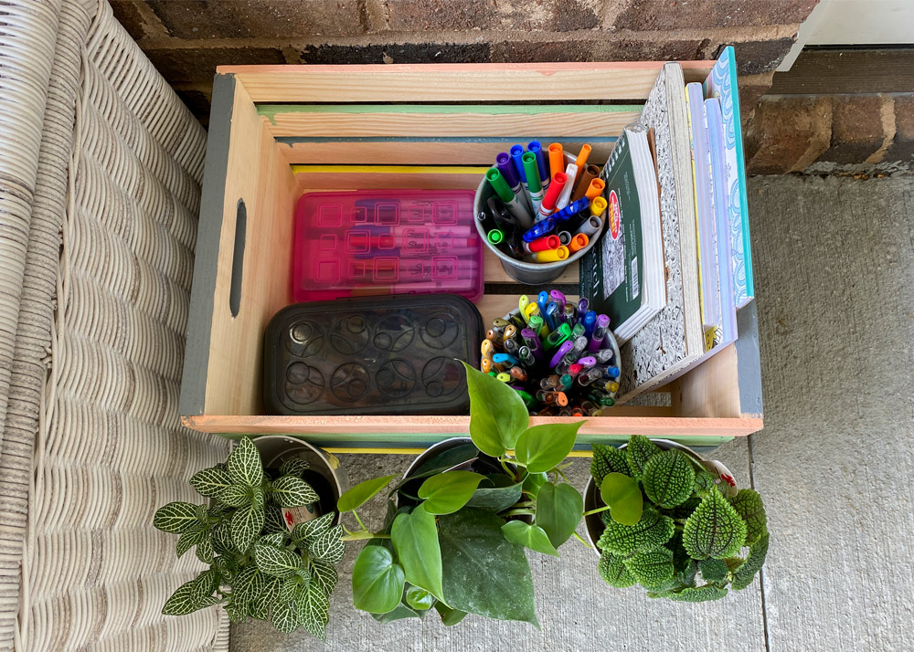 Wooden crate filled with school supplies