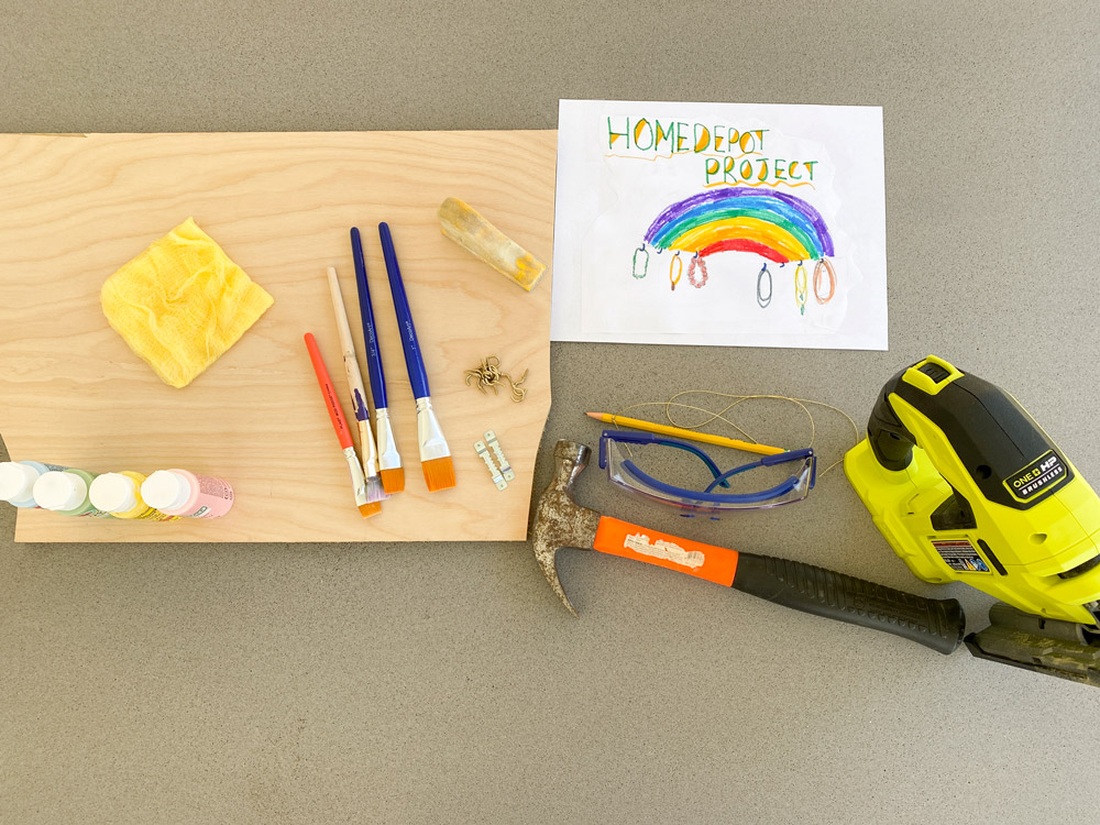 Tools and supplies on a table for a DIY Rainbow Jewelry Holder.