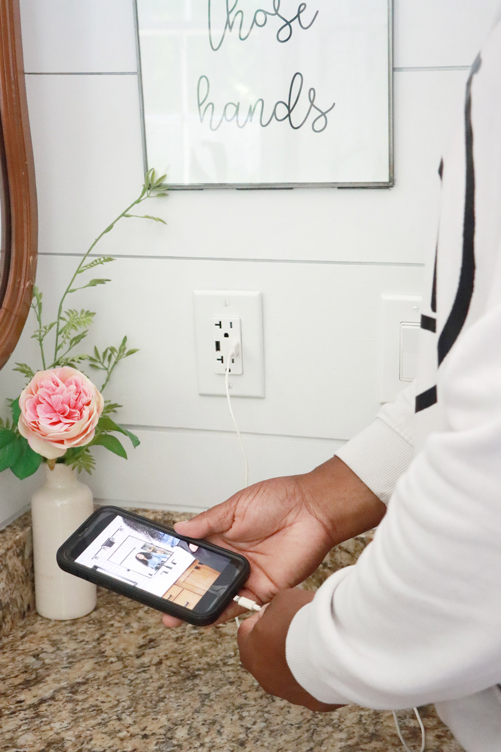 A man plugging his cellphone into the new USB outlets