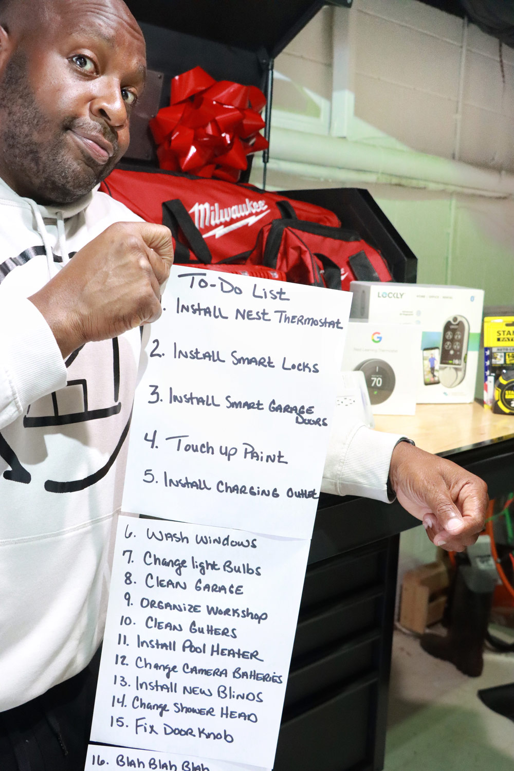 A man standing in front of his new tool chest.