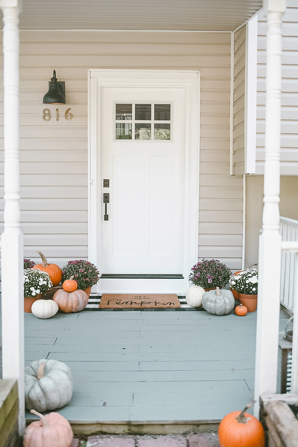 A front door transformation with a new white door and hardware for Fall.
