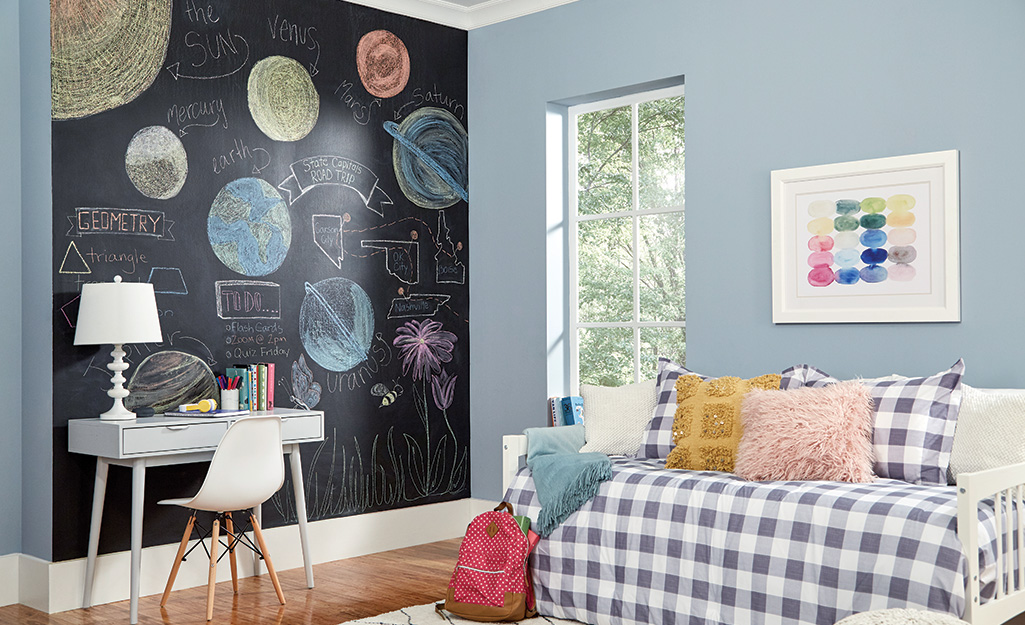 A chalkboard accent wall in a den.