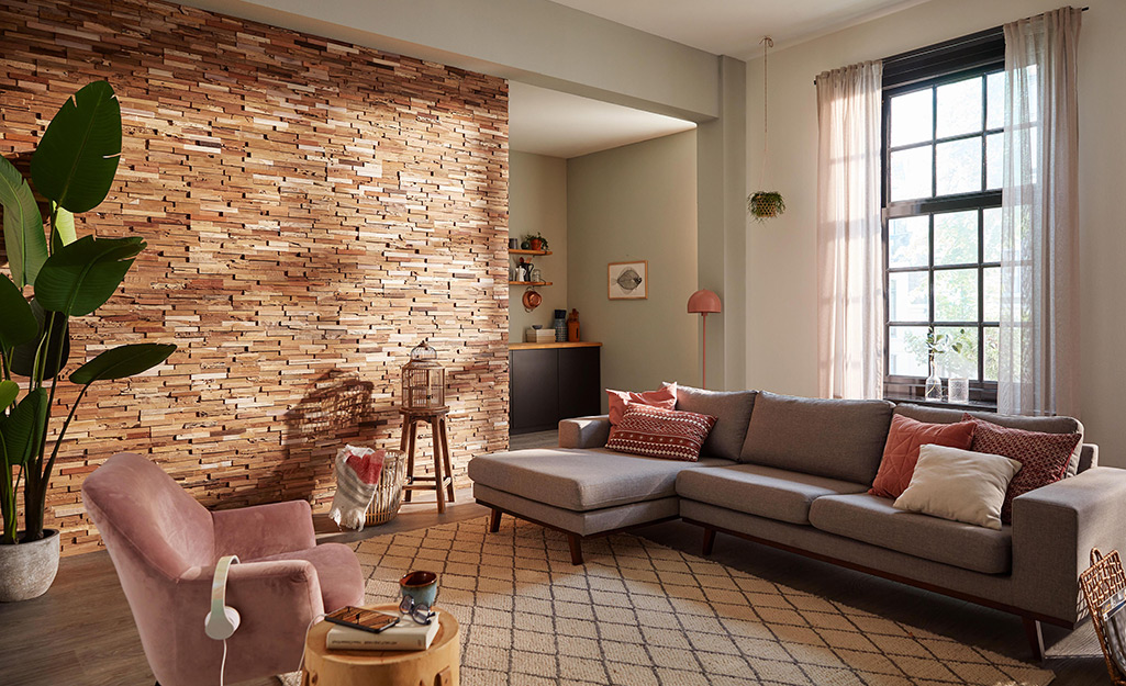 A stacked rock accent wall in a living room.