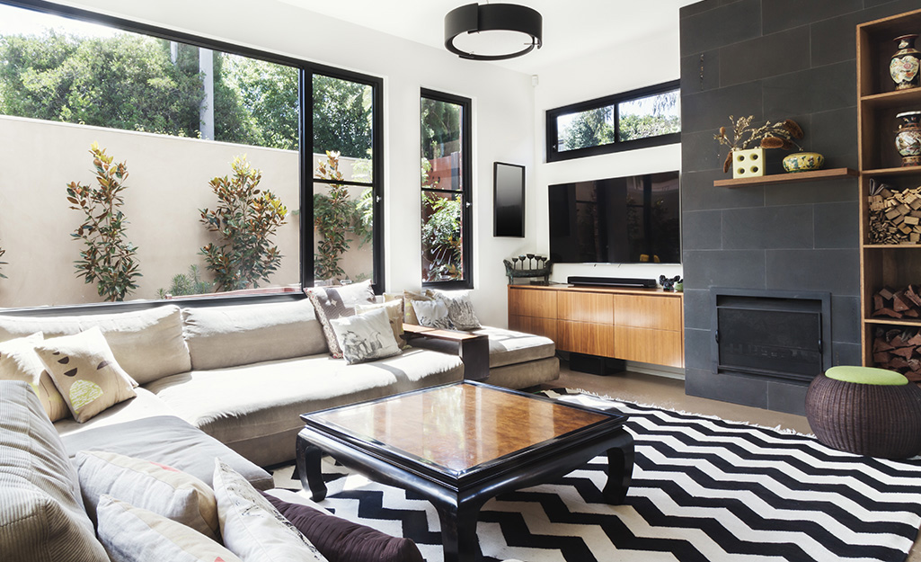 A fireplace and bookcase accent wall in a living room.