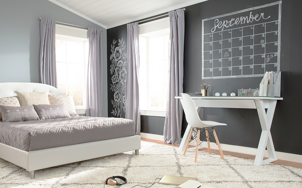 Accent wall painted as a chalkboard.