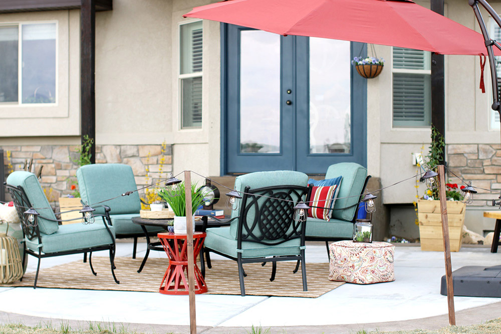 An outdoor area decorated with patio chairs and greenery. An outdoor area decorated with patio chairs and greenery.