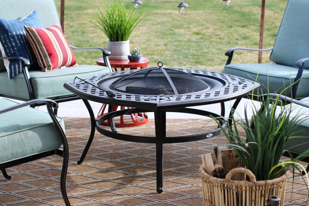 A fire pit surrounded by outdoor seating. A fire pit surrounded by outdoor seating.