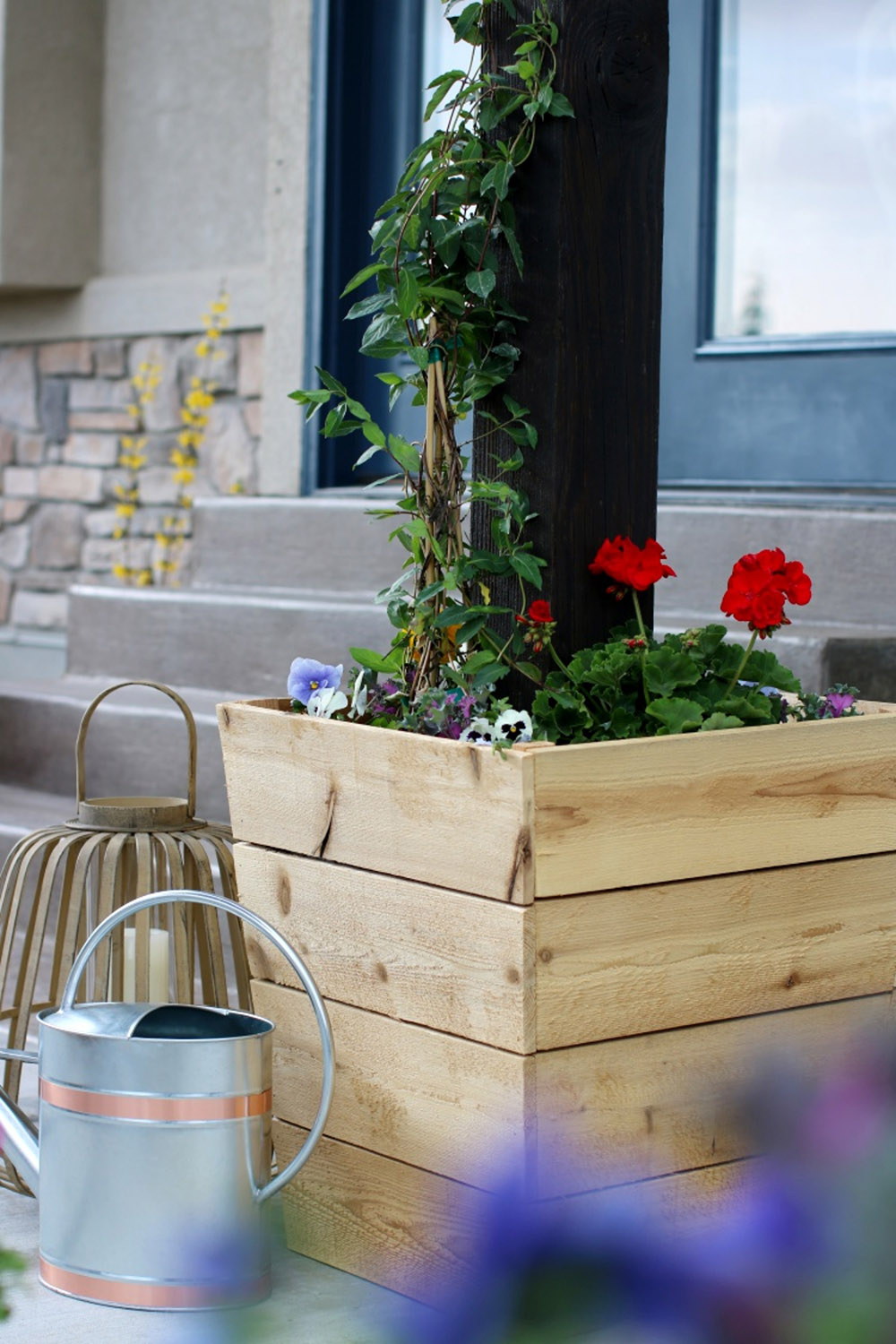 A cedar planter filled with greenery. A cedar planter filled with greenery.