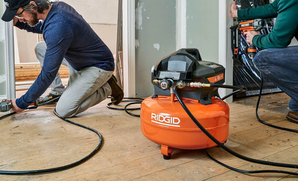 A small portable air compressor in a house being built.