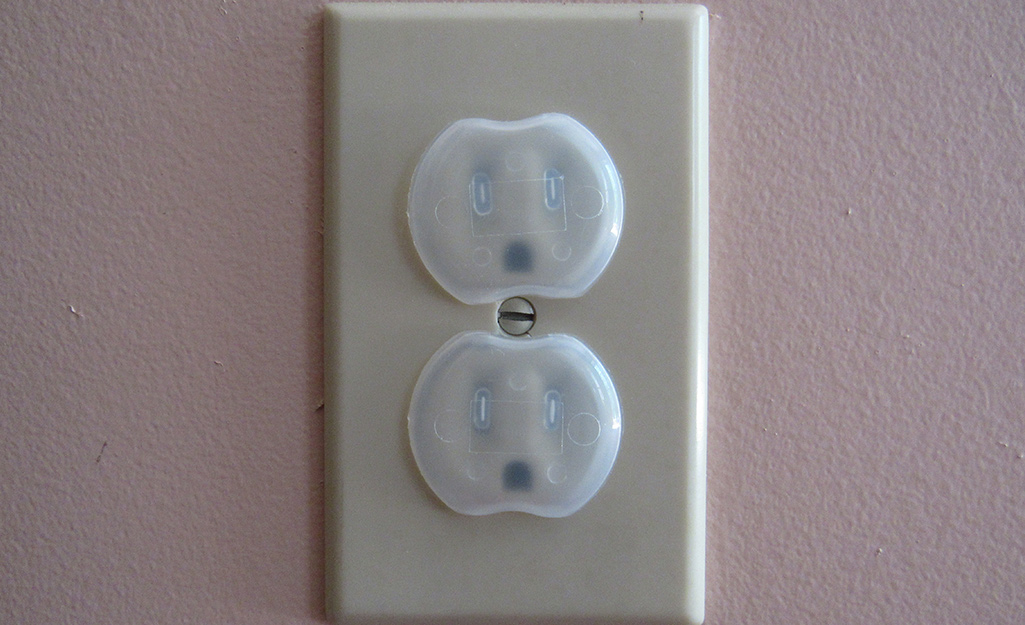 Outlets are covered with plastic outlet covers. Outlets are covered with plastic outlet covers.