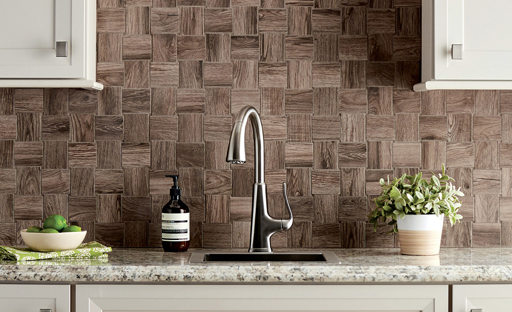 A faux-wood tile backsplash gives a natural look to a contemporary kitchen.