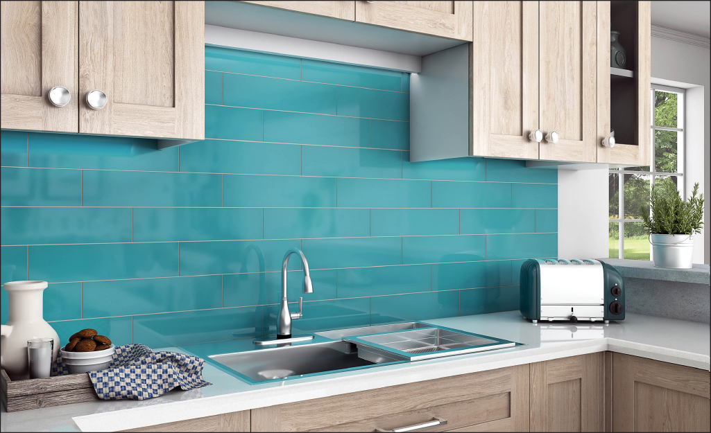An ocean blue kitchen backsplash stands out between natural wood cabinetry.