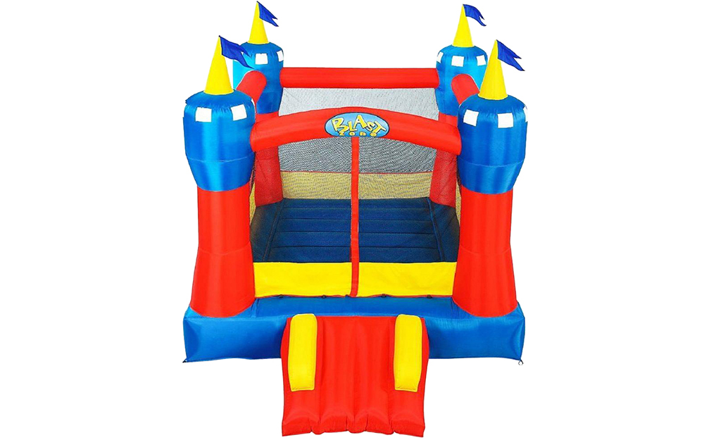 Children playing on an inflatable bounce house.