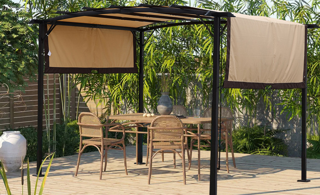 A backyard patio featuring a pergola.