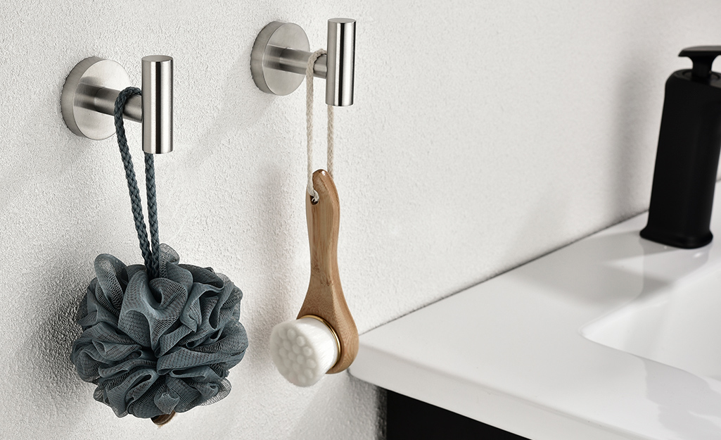 Handy modern hooks hanging near a bath sink.